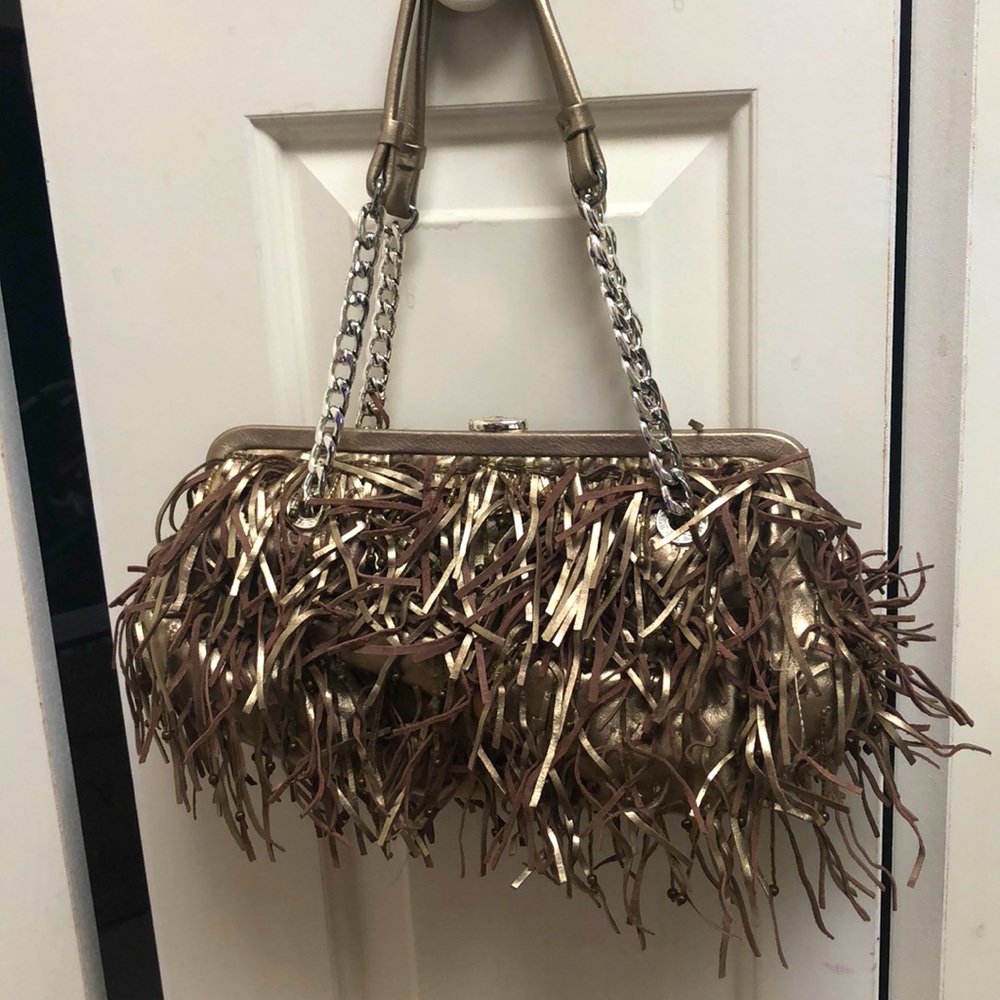 Michael kors bag. Soft metallic leather fringe and beads. With bag.authentic